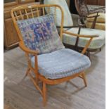 A vintage Ercol light elm armchair. Condition- some wear to the finish, movement to the joints of