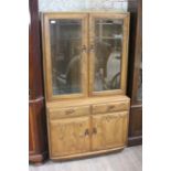 A modern Ercol glazed display cabinet. Excellent condition.