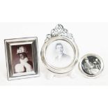 A group of three photograph frames, one modern hallmarked silver, another marked 'Sterling' and with