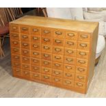 A light oak cabinet of 49 file drawers, 20th century, width 114cm, depth 47cm & height 85cm.