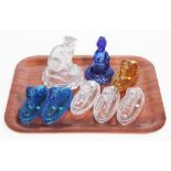 A group of 19th century pressed glass paperweights comprising six lions, French dog and Punch.