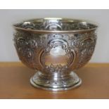 An Irish silver bowl, repousee decoration, pedestal foot, Dublin 1950, diameter 13.5cm, wt. 7 1/