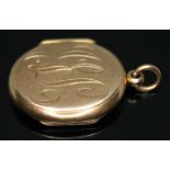 An antique double opening locket, swivel photograph frame to interior, engraved initials to front,