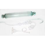 Four pieces of 19th century glass comprising a Nailsea type pipe, a twist cane, a rolling pin and
