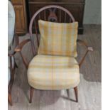 A vintage Ercol dark elm 'Fleur de Lys' armchair. Condition- some wear to the finish, mostly to