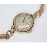 A ladies 9ct gold Rolex Precision, ref. 03860, cal. 1300, case length 32mm, signed silvered dial,