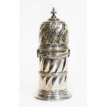 An Edwardian large silver sugar sifter, pierced and twist top with bayonet fitting, waisted twist