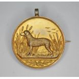 An Edwardian dog show medal (converted to pendant brooch), the reverse inscribed 'Curly Retriever