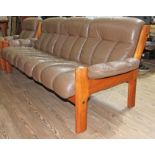 A vintage Ekornes Montana three seater settee in brown leather.