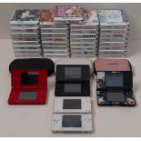 A collection of Nintendo DS games and handheld consoles + chargers.