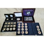 A collection of commemorative gold plated coins and medallions.