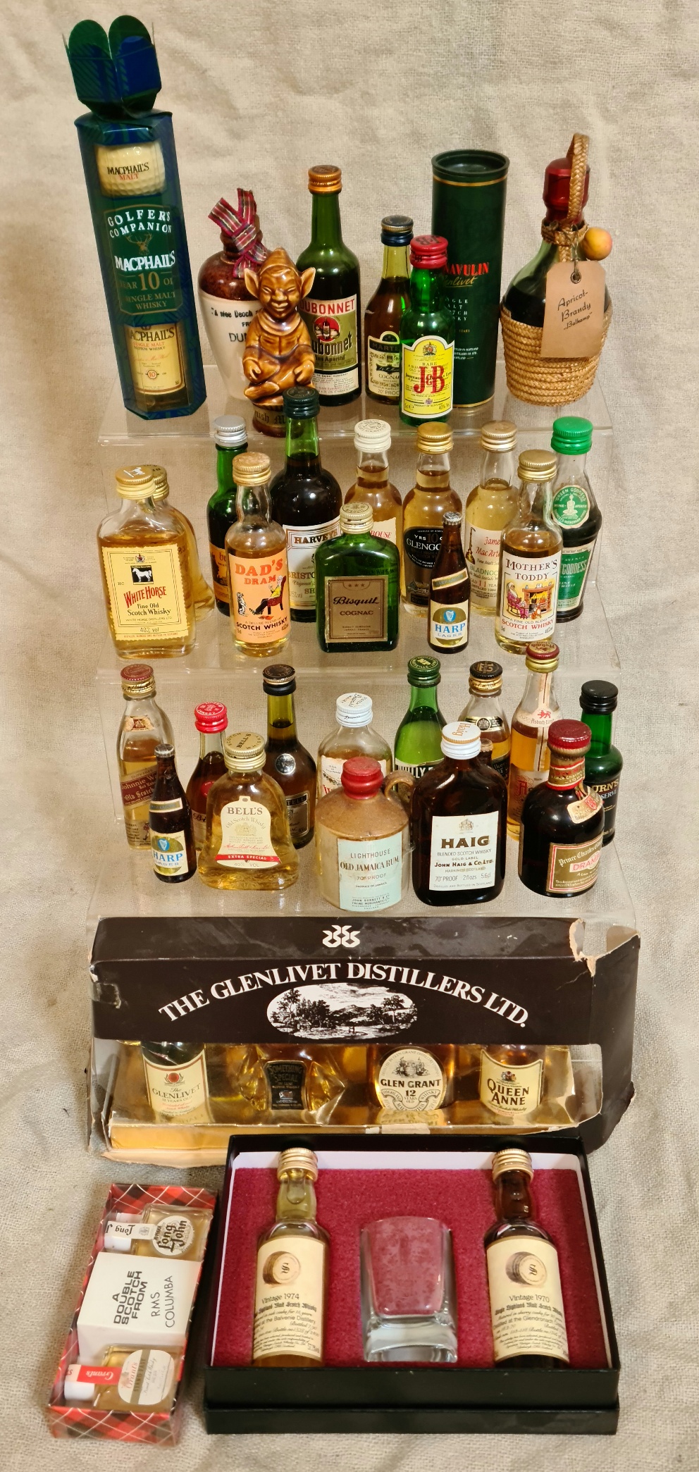 A collection of miniature alcoholic bottles to include 2 sets.