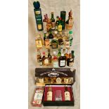 A collection of miniature alcoholic bottles to include 2 sets.