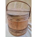 A vintage 1920s lidded pine grain barrel or measure with swing handle.