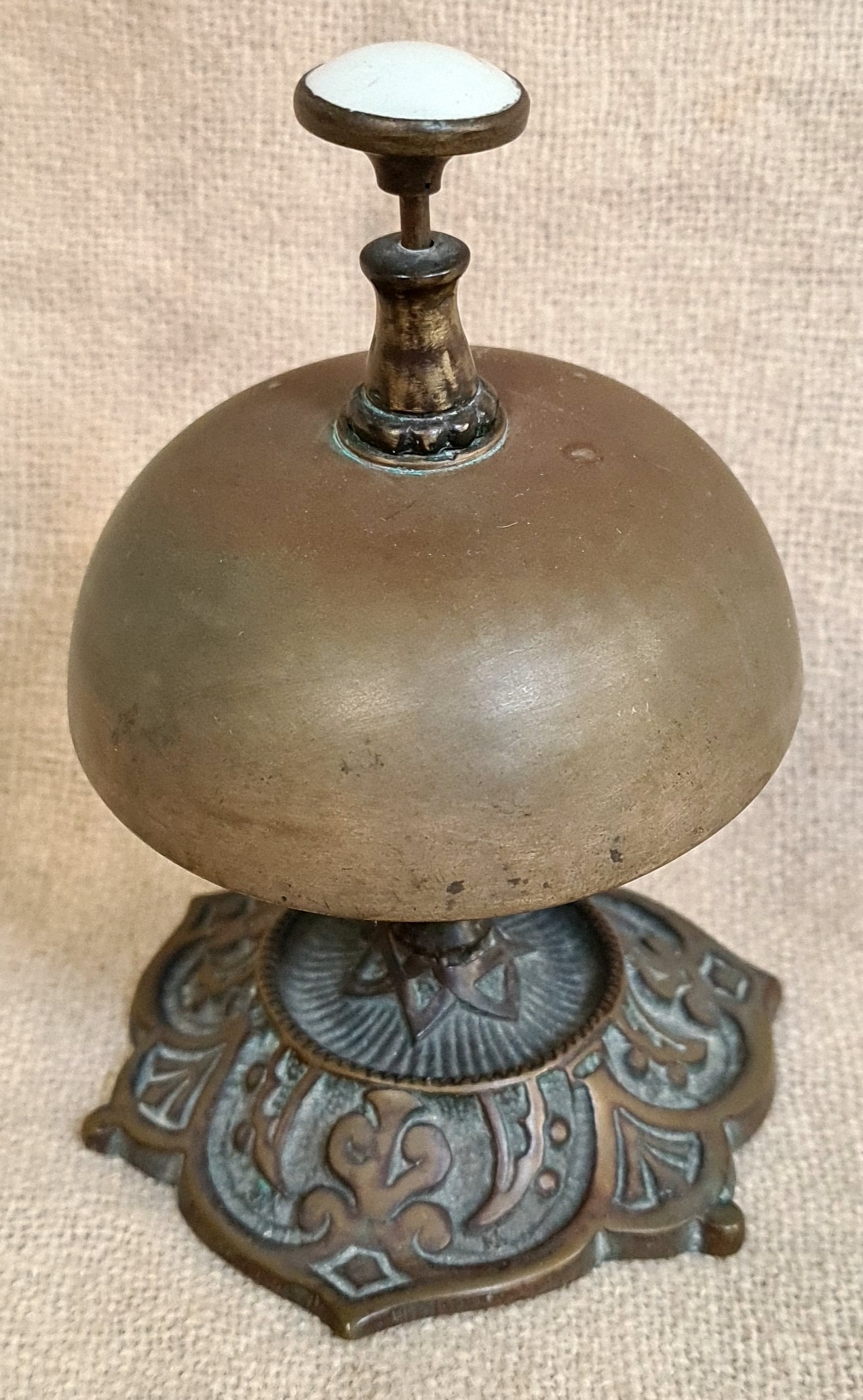 A vintage brass desk bell.