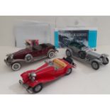 A group of three Franklin Mint die-cast models.