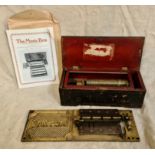 Two antique music boxes, baseplates and related magazines.