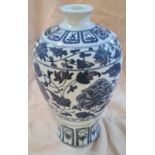 A blue and white Chinese vase decorated with flowers.