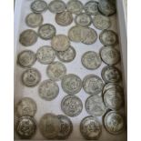 A collection 39 of pre WWII one shilling coins.