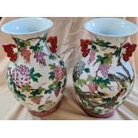 A pair of Chinese porcelain vases decorated with birds, flowers and fruit.