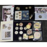 A case of assorted coins and coin covers including a 2011 1/2 ounce silver £1, oversized gold plated