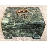 A green hard stone trinket box on square feet, with lid, having brass lizard on top and brass