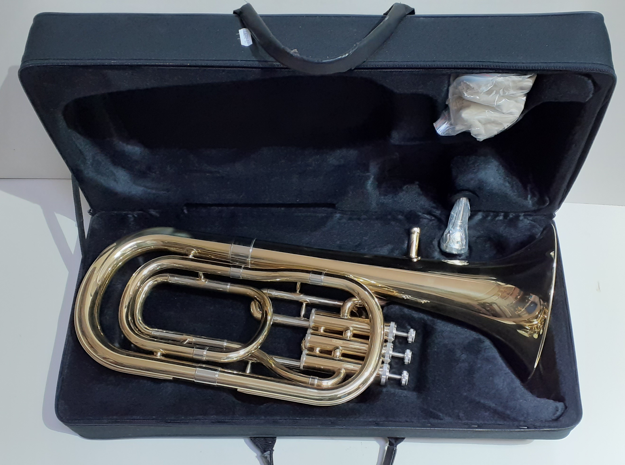 A Rosetti 5 series brass baritone horn, with nickel valves, in original case.