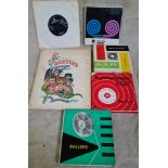 A First Edition paperback "The Beatles Illustrated Lyrics" plus two original Beatles 45 records