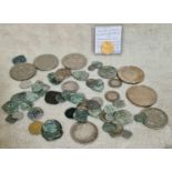 A collection of coins to include ancient hammered coins, commemorative crowns and half crowns etc.