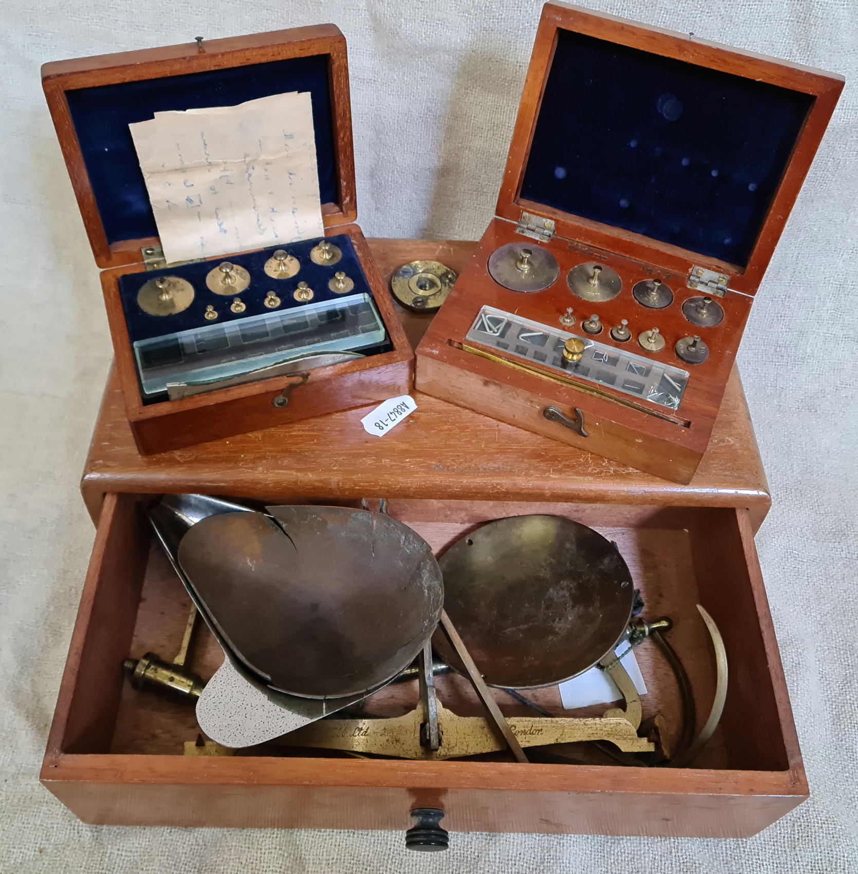 Vintage cased scales and brass weights.