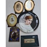 A set of three photograph frames and a brass pierced frame.