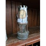 A miner's lamp, made in Eccles Manchester, converted to electric.