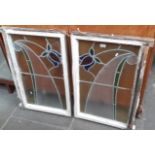 A pair of Edwardian Art Nouveau leaded glass window panels with tulip design.