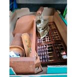 A box of treen to include abbacus, pencil and pen holder, brass flat iron, a cast metal flat iron,