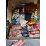 A box of collectables including a carved painted figure, a signed glass scent bottle, buttons etc.