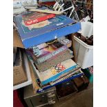 A collection of board games including Peter Rabbit race game, Waddington's table soccer game etc