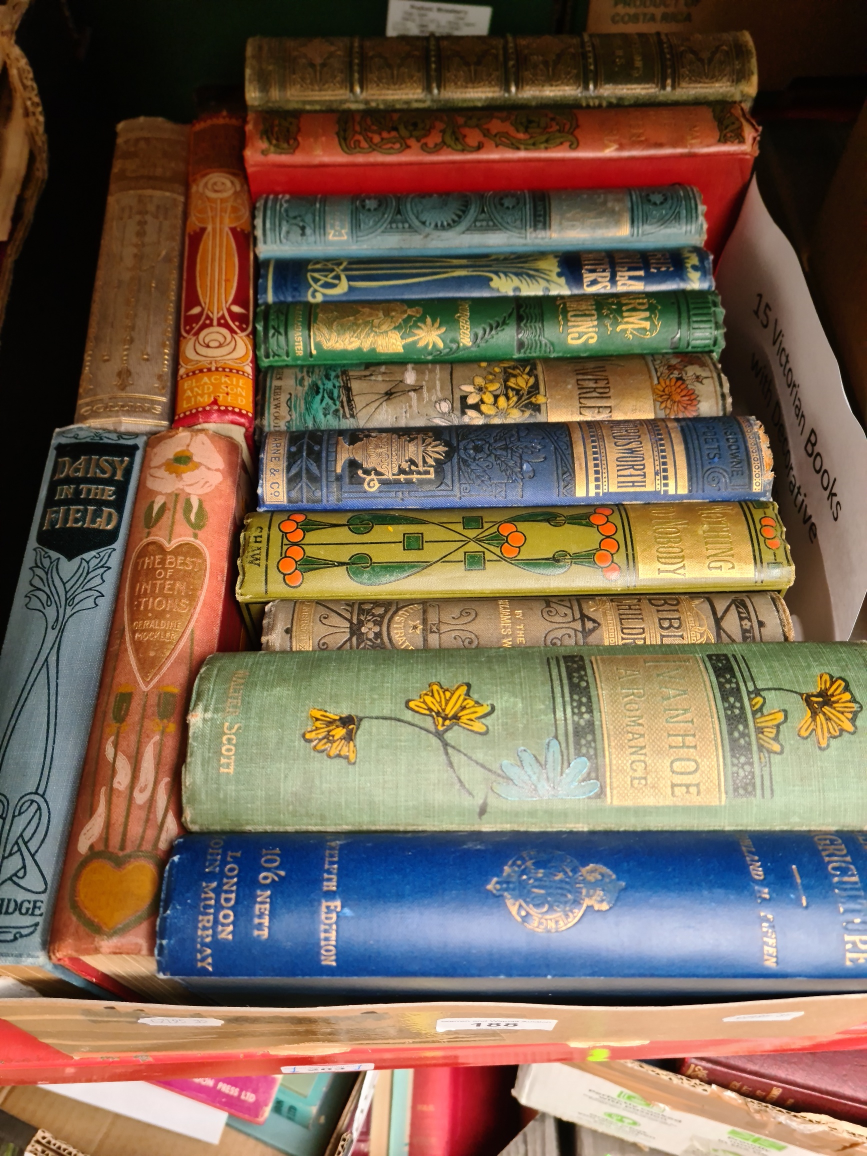 Assorted early 20th century books including Art Nouveau covers.