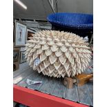 A palm leaf ball shaped light fitting.