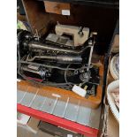 An electric Singer sewing machine - no foot pedal and a vintage Vulcan child's sewing machine.