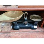 A set of vintage cast metal weighing scales with brass trays - no weights.