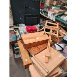 A table top of artist's materials including easel, brushes, guillotine, paints including oils,