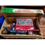 A boxed tin toy bus, battery operated, in working order.