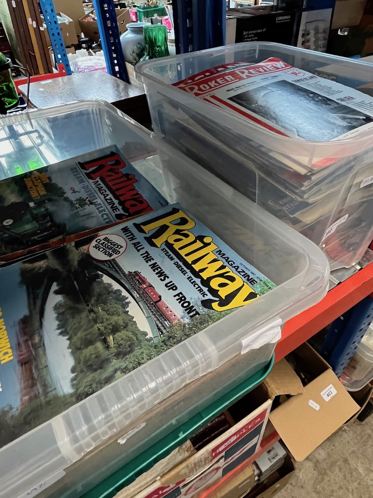 A box of assorted football programmes and a box of railway magazines.