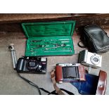3 cameras, mini tripod and an Alfa draughstman's set.