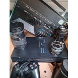 PS2 console, vintage Binatone radio, Sigma & Hanimex camera lenses.