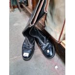 A pair of black leather boots, size 9.