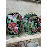 A pair of modern Chinese pottery vases decorated with flowers.