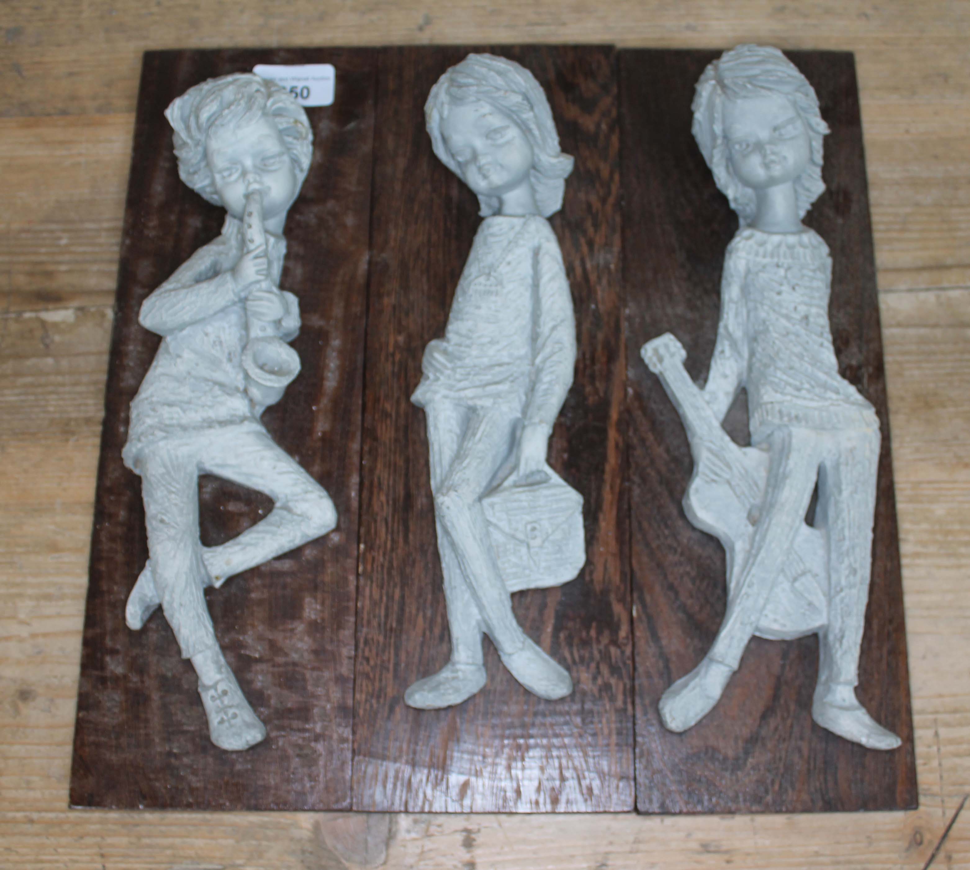 3 composition figures on wooden plinths, labelled 'Kunsthandel Brock Holland'.