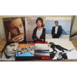 Seven Bruce Springsteen LPs.