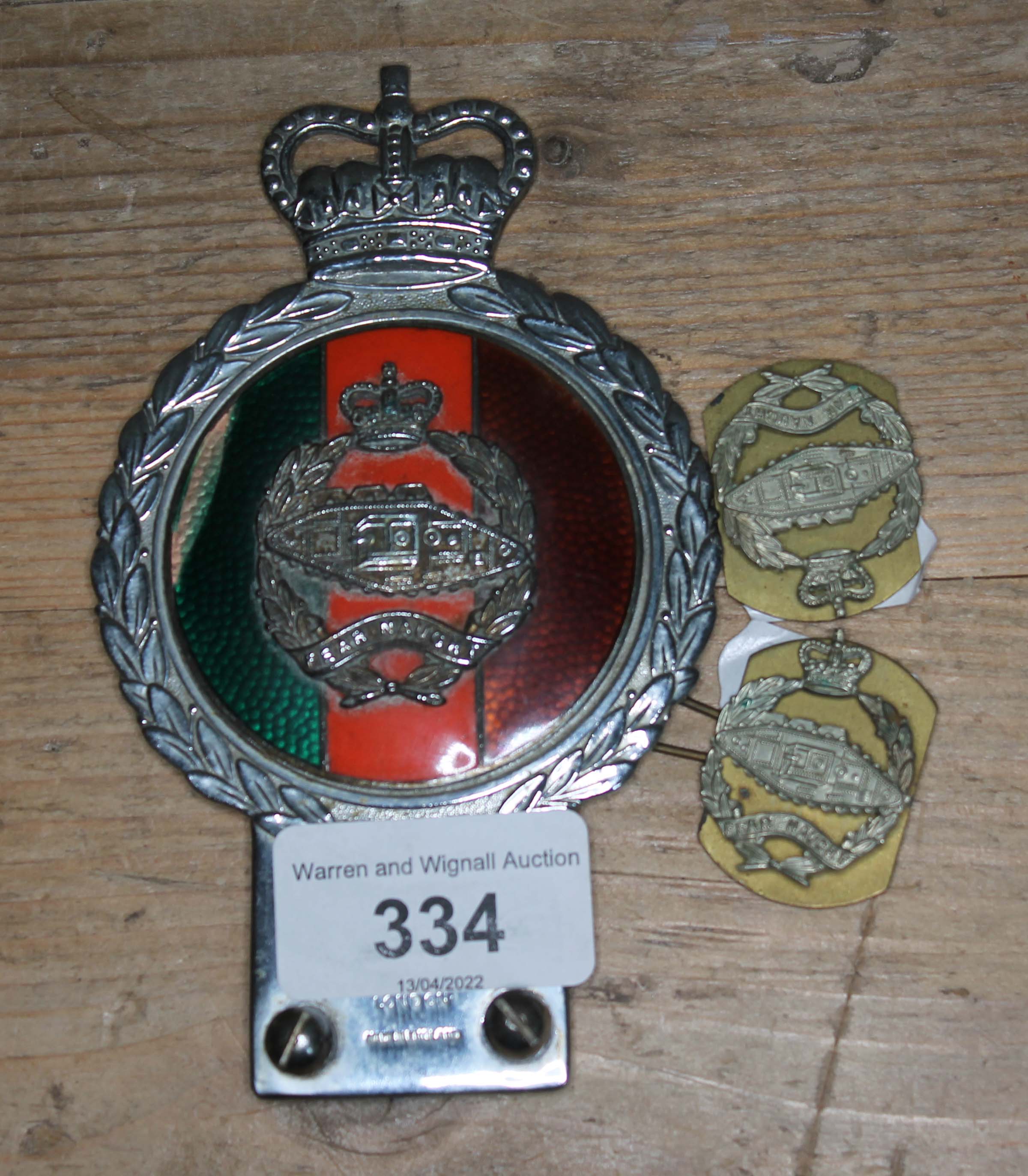 A Royal British Tank Regiment vehicle badge by J R Gaunt London and two similar badges.